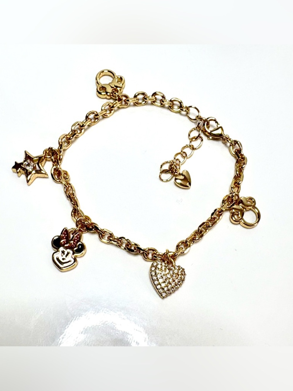 Minnie Mouse themed charms in 18k gold filled dainty charm bracelet.